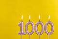 Candle 1000 with flame - Birthday card on yellow luxury background