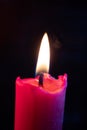 Candle flame flickers in the wind Royalty Free Stock Photo