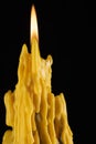 Candle flame melting wax to create dramatic and unique patterns and textures orange Buddhist candles Royalty Free Stock Photo