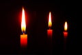 Candle flame at night. Candle lit in a dark room with dark background Royalty Free Stock Photo