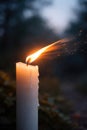 A candle with a flame in the wind. Royalty Free Stock Photo