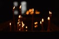 Candle flames on a black background