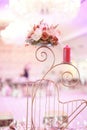 Candle and flower stand on wedding table Royalty Free Stock Photo