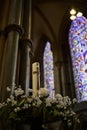 Candle and flowers in the Cathedral in Lincoln, Lincolnshire on September 19, 2023 Royalty Free Stock Photo