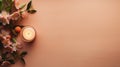 A candle and flowers on a peach fuzz pink background with copy space, AI