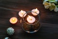 A candle in a glass vase, decoration and various interesting elements. Candles burning. Royalty Free Stock Photo