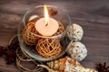 A candle in a glass vase, decoration and various interesting elements. Candles burning. Royalty Free Stock Photo