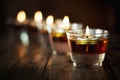 Candle glass votive. Candle in jar on wooden table