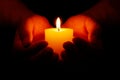 Candle in hands Royalty Free Stock Photo
