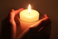 Candle in hands