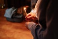 Candle in the hands of a woman in the church during the service. Royalty Free Stock Photo