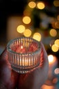 candle in the hands of a woman in a hand on a background of a burning candles Royalty Free Stock Photo
