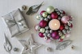 Candle holder made of glass balls and silver gift. Beautiful table decoration Royalty Free Stock Photo