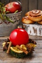 Candle holder made of moss, dried fruits and cinnamon sticks Royalty Free Stock Photo