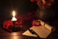 The candle illuminates the Desk