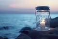 Candle in a jar on the background of the beach. Summer backgound.