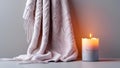 Candle with knit blanket Royalty Free Stock Photo