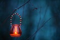 Candle lantern hanging from tree branch Royalty Free Stock Photo