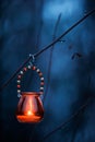 Candle lantern hanging from tree branch Royalty Free Stock Photo