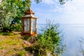 Candle lantern hanging on a tree branch Royalty Free Stock Photo