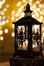 Candle lantern on log with bokeh lights