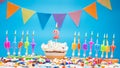 Candle letter word happy birthday to a one year old child with number two on a beautiful blue background. Copy space Happy Royalty Free Stock Photo