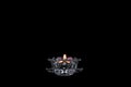 Candle light on a black background, candlestick close-up, burning flame Royalty Free Stock Photo