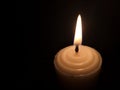 Candle light in the dark. Various brightness from fire. No wind. Copy space. Royalty Free Stock Photo