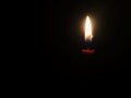 candle light shining in the darkness Royalty Free Stock Photo