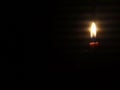 candle light shining in the darkness Royalty Free Stock Photo