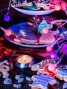Candle light table with Christmas gingerbread cookies.
