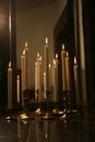 Burning candles in retro candlesticks indoor. Royalty Free Stock Photo