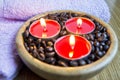 Candle lights with coffee beans for spa and christmas decoration concept Royalty Free Stock Photo