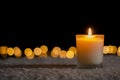 Candle lights in darkness with golden bokeh lights Royalty Free Stock Photo