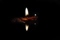 Candle lights with reflection on glass surface Royalty Free Stock Photo