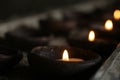 Candle lights on a traditional ceramic bowls on dark background. Holy week concept. Spiritual concepts.