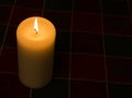 Candle lir against dark background with copy space Royalty Free Stock Photo