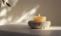 A candle is lit on a stone Royalty Free Stock Photo
