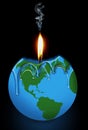 A candle that looks like a globe of the earth is melting as a flame burns down the wick Royalty Free Stock Photo