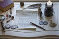 Antique writing materials and a candle on the table Royalty Free Stock Photo