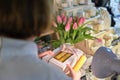 candle maker shares her creation with an eager buyer, surrounded by an array of fragrant candles and artisanal products Royalty Free Stock Photo