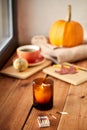 candle and matches on window sill in autumn