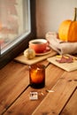 candle and matches on window sill in autumn
