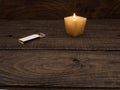 Candle and matches on a wooden table