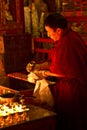 Candle monk of Drepung Monastery Lhasa Tibet