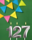 Candle number 127 birthday - Green anniversary card with pennants