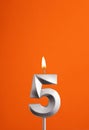 Candle number 5 - Birthday in orange foamy background