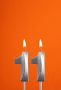 Candle number 11 - Birthday in orange foamy background