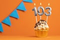 Birthday cake with candle number 103 - Orange background Royalty Free Stock Photo