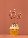 Candle number 136 - Cupcake birthday in coral fusion background